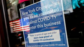 NYC vaccine-checker caught in her own trap