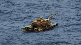 Mysterious ‘tank’ spotted floating at sea (PHOTOS)