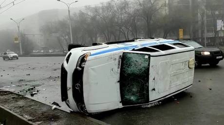 An overturned police car during a protest triggered by fuel price increase in Almaty, Kazakhstan. © Sputnik