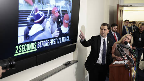 Matt Gaetz motions to footage from the January 6 attack on the US Capitol during news conference in Washington DC