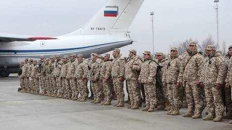 Tajik servicemen, who are part of the Collective Security Treaty Organization (CSTO) peacekeeping force, depart to Kazakhstan from Ayni Air Force Base in Tajikistan on January 7, 2021.