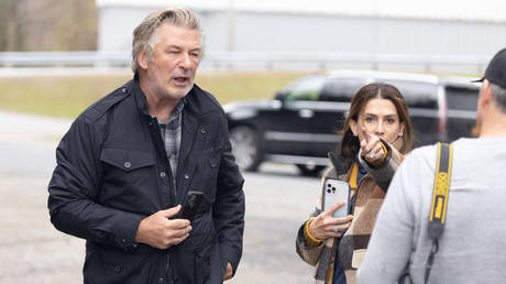 FILE PHOTO: Alec Baldwin and his wife Hilaria give an impromptu interview in Manchester, Vermont, October 30, 2021.