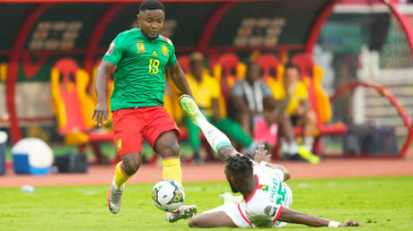 Steeve Yago (right) challenges Collins Fai © Ulrik Pedersen / NurPhoto via Getty Images