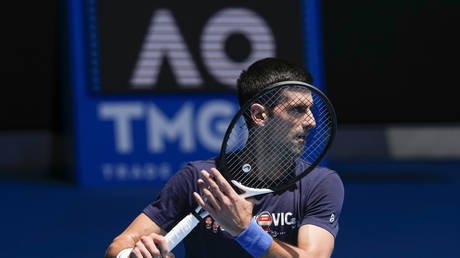 Serbia's Novak Djokovic practices on Rod Laver Arena ahead of the Australian Open tennis championship in Melbourne, Australia, Jan. 12, 2022