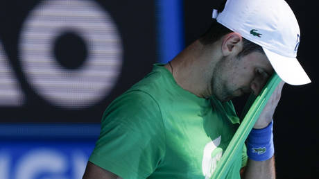 Novak Djokovic practices on Margaret Court Arena ahead of the Australian Open tennis championship in Melbourne, Australia, Thursday, Jan. 13, 2022.