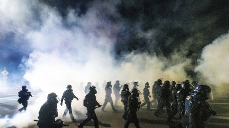 Police use chemical irritants and crowd control munitions to disperse protesters during a demonstration in Portland, Oregon, Sept. 5, 2020