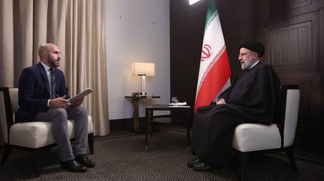 Iranian President Ebrahim Raisi (right) sat down with RT for an exclusive interview, January 20, 2022