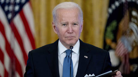 President Joe Biden listens to reporter's questions during a Competition Council meeting in the East Room of the White House, January 24, 2022.