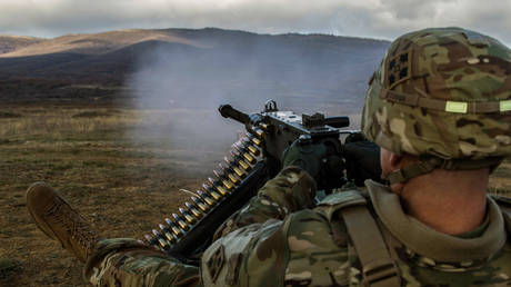 File photo: US Army Lt. Col. Steven Templeton of the 4th Infantry Division, fires a machine gun at Novo Selo Training Range, Bulgaria, December 14, 2018.