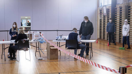 A testing station in a school sports hall as pupils return to school at Dueholmskolen, Denmark, Monday March 1, 2021