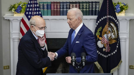 Joe Biden shakes hands with US Supreme Court Justice Stephen Breyer in the Roosevelt Room of the White House