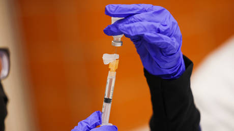 Pfizer COVID-19 vaccine booster shot is prepped at Mount Sinai South Nassau Vaxmobile that visited Freeport High School, New York, November 30, 2021