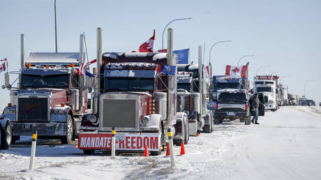 A truck convoy of anti-COVID-19 vaccine mandate demonstrators continue to block the highway at the busy US border crossing in Coutts, Alberta, February 2, 2022