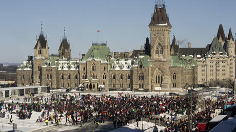 Protesters gather on Parliament hill as trucks continue to block the downtown core in protest of Covid-19 mandates in Ottawa, February 5, 2022