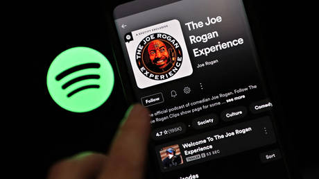 The Joe Rogan Experience podcast is viewed on Spotify's mobile app. © AFP / Indy Ord