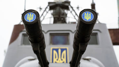 FILE PHOTO. Lids emblazoned with a Ukrainian emblem cover the barrels on a gun mount aboard a Ukrainian coast guard ship in the Sea of Azov.