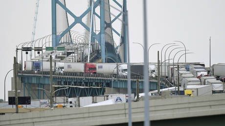 Trucks backed up on the Detroit, Michigan side of the Ambassador Bridge between the US and Canada, February 7, 2022.
