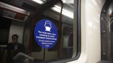 A sign outlines Covid restrictions on the London Underground. © Rasid Necati Aslim / Anadolu Agency / Getty Images