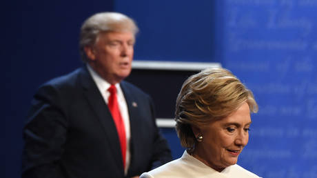 FILE PHOTO: Hillary Clinton and Donald Trump walk off the stage after the final debate of the 2016 US election. October 19, 2016. © AFP / Robyn Beck