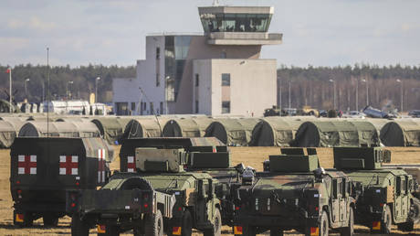 US military vehicles at base for troops, established at the Mielec Airport in Poland