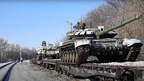Russian army tanks are loaded onto railway platforms to move back to their permanent base after drills in Russia.