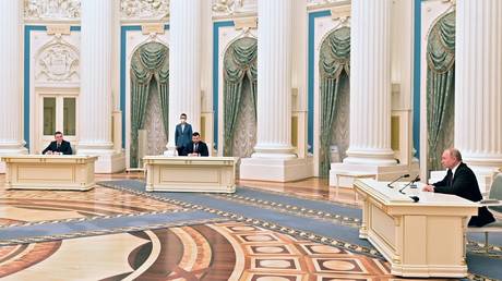 From right, Russian President Vladimir Putin, Heads of the Donetsk and Lugansk People’s Republics, Denis Pushilin and Leonid Pasechnik sign decree to recognise Ukrainian regions as independent entities, in Moscow, Russia.