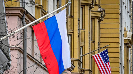A Russian flag flies next to the US embassy building in Moscow on April 15, 2021