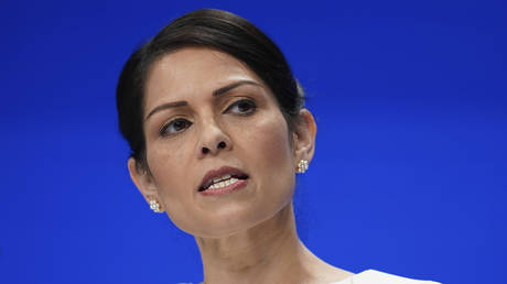 FILE PHOTO: Priti Patel speaks at the Conservative Party Conference in Manchester, England, October 5, 2021 © AP / Jon Super
