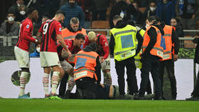 Fan fury as pitch invader 'punched' during Milan derby (VIDEO)