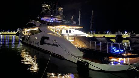 A yacht belonging to Russian businessman Alexey Mordaschov is seen as police seize it under a recent round of EU sanctions, in Imperia, Italy, March, 4, 2022.