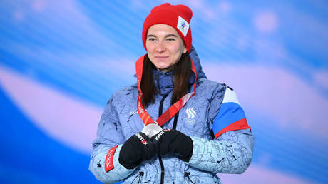 Ski sensation wins title while suspended for being Russian