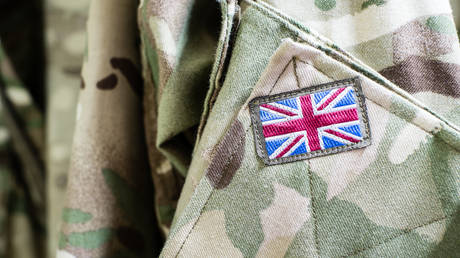 FILE PHOTO. Union Jack flag on sleeve of British military camouflage uniform