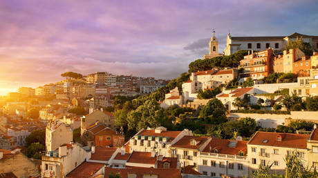 Portugal, Lisbon, Old Town, church and Miradouro de Graca at Sunset