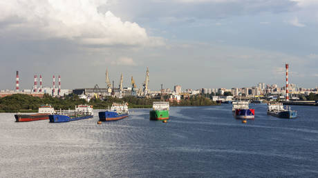 FILE PHOTO: Oil tanker ships and cranes are seen at Merchants Harbor in Saint Petersburg, Russia.