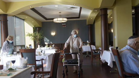May Nast arrives for dinner at RiverWalk, an independent senior housing facility, in New York, April 1, 2021
