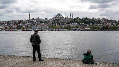 FILE PHOTO. Tourists stand on the Bosphorus banks in Istanbul, Turkey.