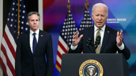 US Secretary of State Anthony Blinken (L) is shown looking on as President Joe Biden speaks earlier this month at a White House event.