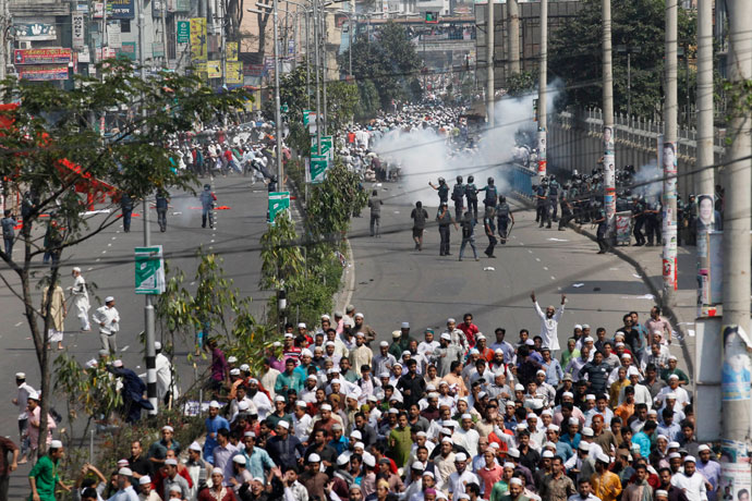 Police throw teargas during a clash with activists from 12 Islamist parties in Dhaka February 22, 2013.(Reuters / Andrew Biraj)
