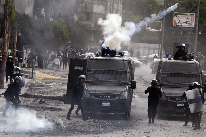 Riot policemen fire tear gas at protesters opposing Egyptian President Mohamed Mursi during clashes along Qasr Al Nil bridge, which leads to Tahrir Square in Cairo January 28, 2013. (Reuters/Amr Abdallah Dalsh)