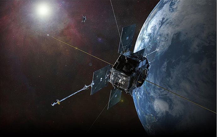 A graphic depicting the twin Van Allen Probes in orbit within Earth's magnetic field.(NASA / JHU / APL)