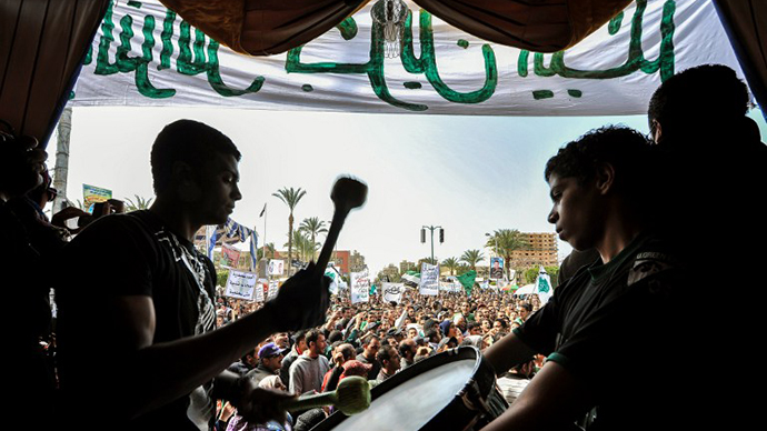 An Egyptian protester plays drums during an anti-government protest in the canal city of Port Said on March 1, 2013. (AFP Photo)