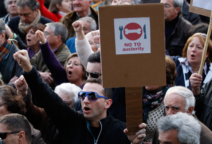 People shout slogans as they take part in a protest against government austerity policies at Lisbon's main square Praca do Comercio March 2, 2013 (Reuters / Hugo Correia)