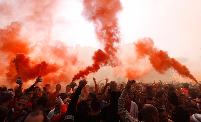 Al-Ahly fans, also known as "Ultras", celebrate and shout slogans in front of the Al-Ahly club after hearing the final verdict of the 2012 Port Said massacre in Cairo March 9, 2013 (Reuters / Amr Abdallah Dalsh)