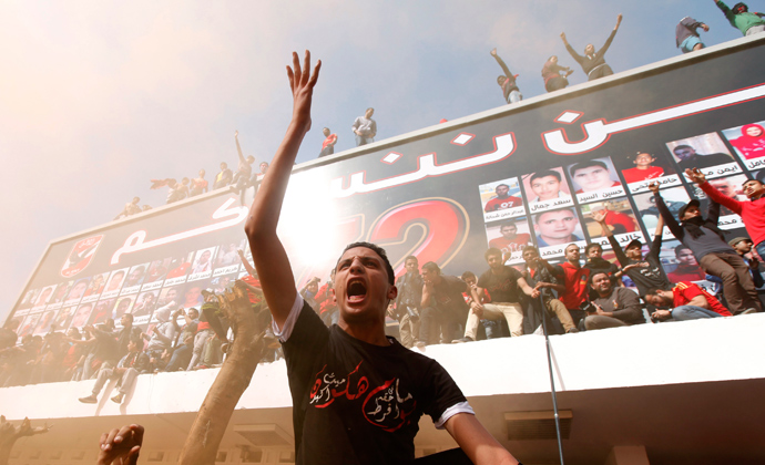Al-Ahly fans, also known as "Ultras", shout slogans against the Interior Ministry, in front of Al-Ahly club after hearing the final verdict of the 2012 Port Said massacre in Cairo March 9, 2013 (Reuters / Amr Abdallah Dalsh)