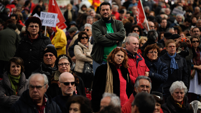 People attend a mass demonstration called by Spain's two main trade unions, CCOO and UGT to protest the country's huge unemployment rate and demand political reform on March 10, 201 in Madrid (AFP Photo / Pedro Armestre)