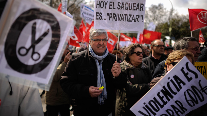 People attend a mass demonstration called by Spain's two main trade unions, CCOO and UGT to protest the country's huge unemployment rate and demand political reform on March 10, 201 in Madrid (AFP Photo / Pedro Armestre)