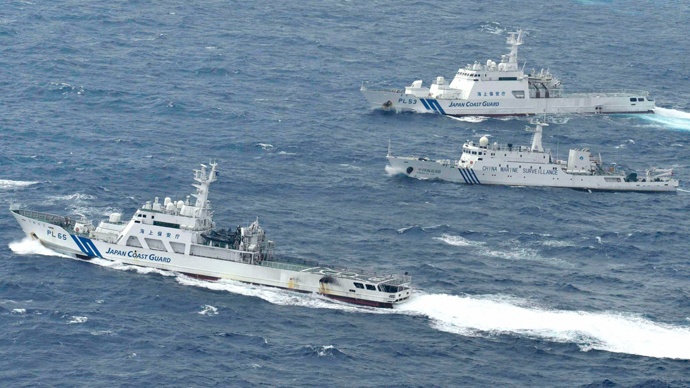 An aerial photo shows a Chinese marine surveillance ship Haijian No. 66 (C) cruising next to Japan Coast Guard patrol ships in the East China Sea, known as Senkaku isles in Japan and Diaoyu islands in China (Reuters / Kyodo)