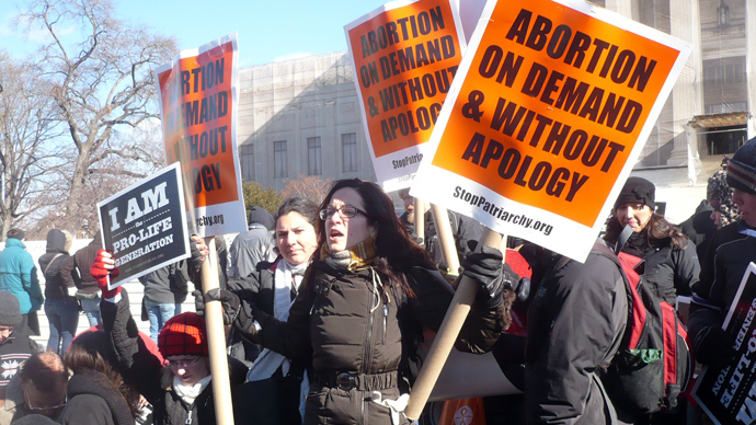 People protest on January 22, 2013 in front of the US Supreme Court in Washington,DC. Thousands of pro-life activists descended on the US capital Tuesday to mark the 40th anniversary of a landmark US Supreme Court ruling guaranteeing abortion rights under the Constitution (AFP Photo / Fabienne Faur)
