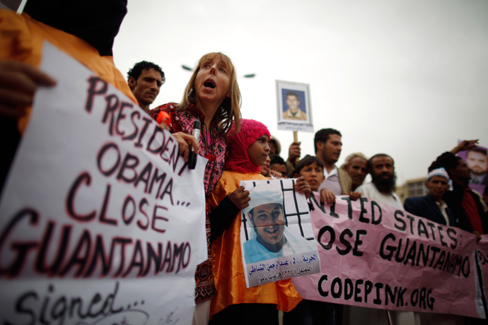 Human rights activists and relatives of Yemeni detainees at Guantanamo Bay prison shout slogans during a protest to demand the release of the detainees, outside the U.S. embassy in Sanaa June 17, 2013 (Reuters / Khaled Abdullah)