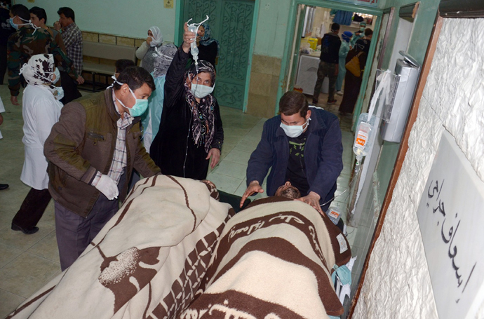 People are brought into a hospital in the Khan al-Assal region in the northern Aleppo province, as Syria's government accused rebel forces of using chemical weapons for the first time on March 19, 2013 (AFP Photo / HO-SANA)